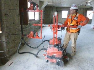 Limiting silica exposure: This innovative drill jig was designed by a University of California Ergonomics Program team, to reduce physical stress and fatigue and limit exposure to silica. Photo courtesy of OSHA.