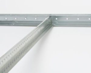 CertainTeed® QuickSpan™ Locking Drywall Grid System is a locking system that features solid cross tees that audibly click into a place for positive lock. Photo courtesy of CertainTeed Ceilings
