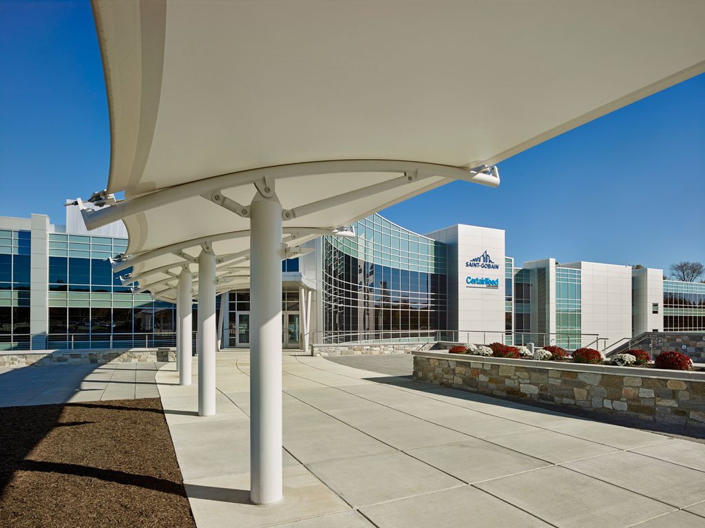 Pictured here is Sheerfill® Fiberglass Architectural Membrane coated with TeflonTM which was installed to create a canopy over the entranceway of the headquarters. Sheerfill is used in many of the world’s landmarks for its contribution to valuable LEED® points and its lowering of air conditioning and lighting costs. It has the potential to transmit up to 17 percent of daylight with long-term reflectivity of over 70 percent. It is also the first architectural membrane to be rated by the Cool Roof Rating Council and is ENERGY STAR® certified. Sheerfill was selected for the headquarters of parent company Saint-Gobain for its maintenance-free attributes, over 25-year life expectancy and its noncombustible features. In addition, the product was selected to create a stunning architectural profile that can be appreciated day or night. Photo: © Jeffrey Totaro