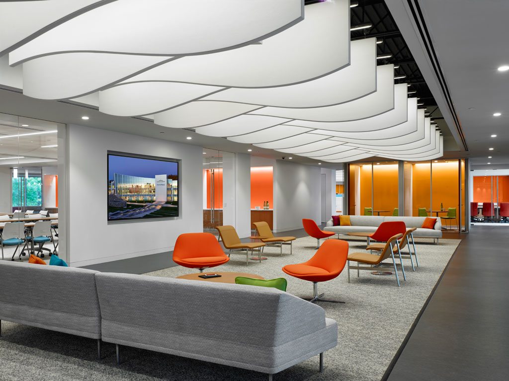 Pictured above is an entryway gathering space just off the main lobby. A variety of CertainTeed’s acoustical ceiling products are featured throughout. This area features SilentFX® for the walls and ceilings and an exposed structure with Decoustics® Baffles. Photo: © Jeffrey Totaro