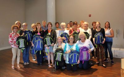 AAMA and World Vision fill 500 backpacks with supplies for in-need children