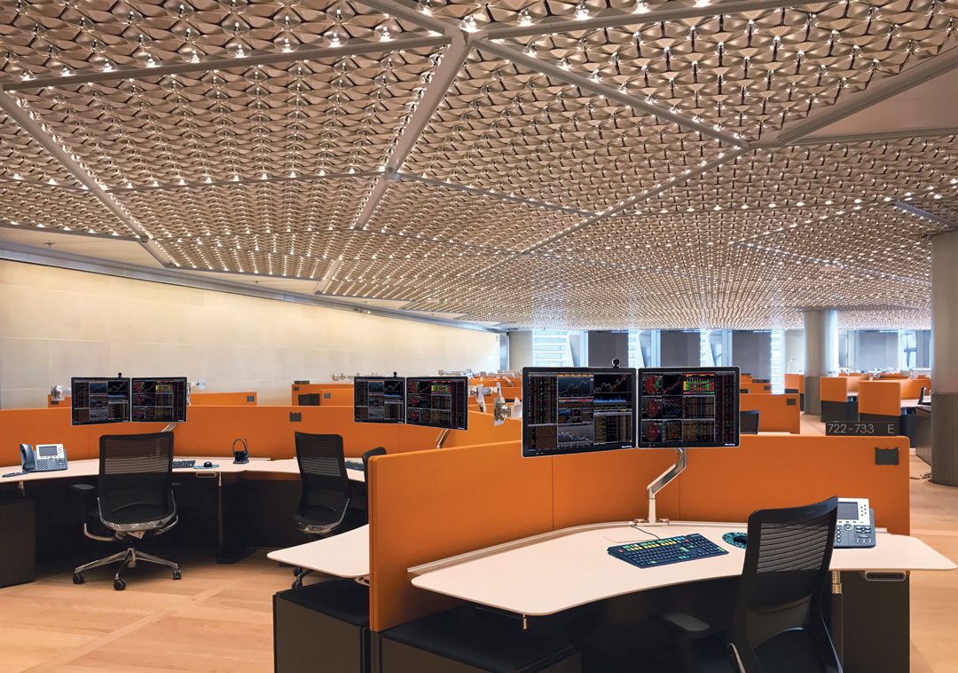 Bespoke integrated ceiling panels combine heating, cooling, lighting and accoustic functions in an innovative petal-leaf design. Credit: ‘Bloomberg’