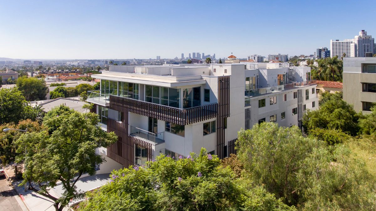 16 contemporary townhomes set amidst the stunning backdrop of the Hollywood Hills. Credit: Scott Evertz