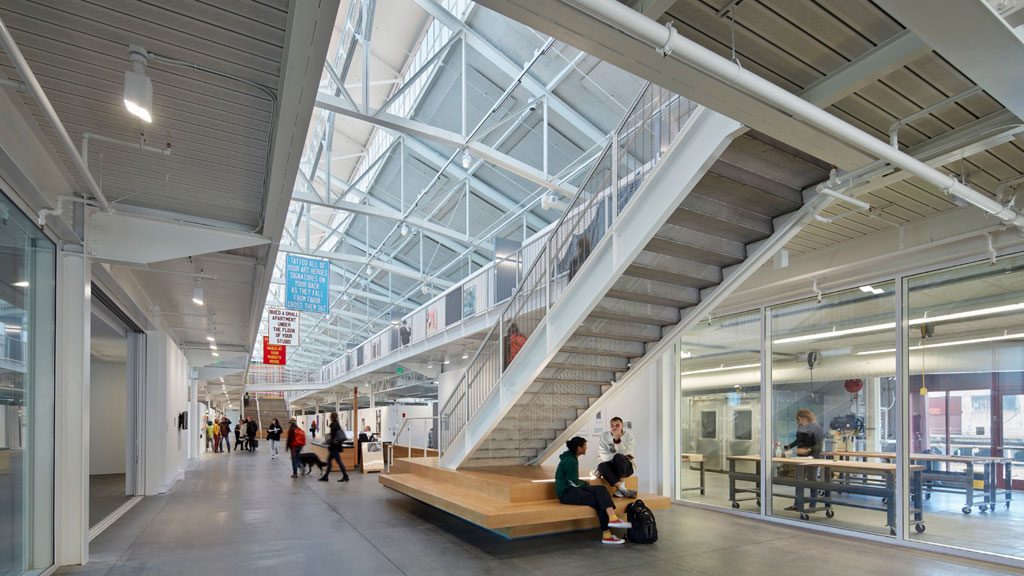 Central atrium and clerestory light monitor with workshop visible to the right and student gallery and media theater to the left. Image: © Bruce Damonte