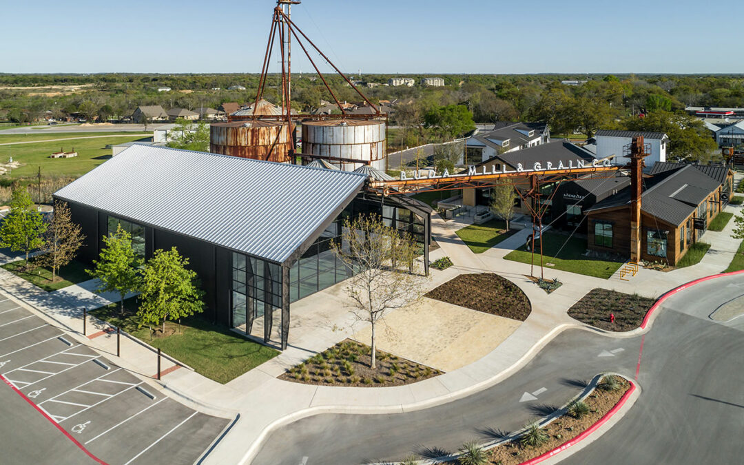 The Buda Mill & Grain Co., a historic agricultural complex reimagined as a community commercial destination in Buda, Texas