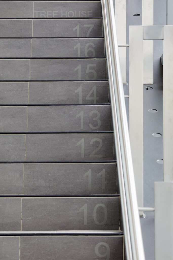 Numbered steps help children gauge their progress while climbing the stairs. Courtesy of Stantec