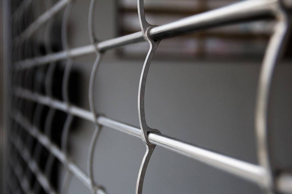 CornellCookson’s Extreme® 300 Series MicroCoil® Grille. This product development reduces headroom for rolling grilles by nearly 50% all while providing the desired level of safety and security. 