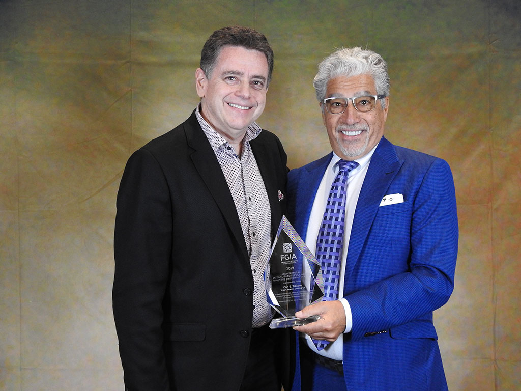 The Architectural Distinguished Service Award was presented to Carl Troiano, President of Trojan Powder Coatings, by previous award recipient Robert Jutras, Principal Engineer, Building Envelope Performance for CLEB Laboratory.