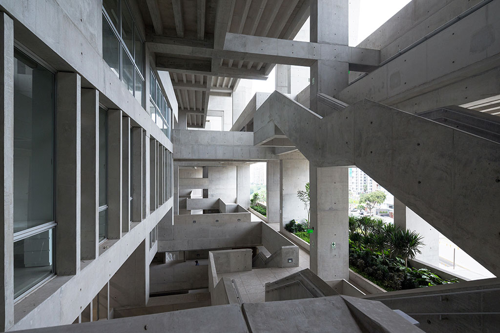The architects have created a muscular building with raw concrete finishes, some say reminiscent of brutalism. Structure and architectural spaces work together to form a new circulation landscape. The section naturally creates numerous spontaneous and humane gathering spaces throughout the building. Photo credit: © Iwan Baan, courtesy of the Pritzker Architecture Prize