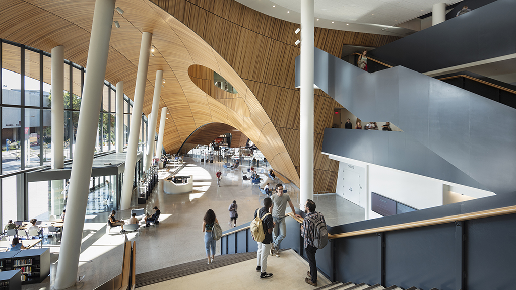 The atrium features an oculus that serves as a building navigation anchor, visually opening up the library’s upper-floor functions to visitors in the main lobby. Photo by Michael Grimm Photography, 2019, Charles Library, Temple University
